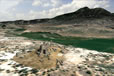 Cybermontage of electronic archaeological model of Castle Rock Pueblo over contemporary photographic topography view downloaded from the Internet. View looking Southeast shows the dramatic siting of the Pueblo, with proximity to the verdant McElmo Creek, in the shadow of Sleeping Ute Mountain. 